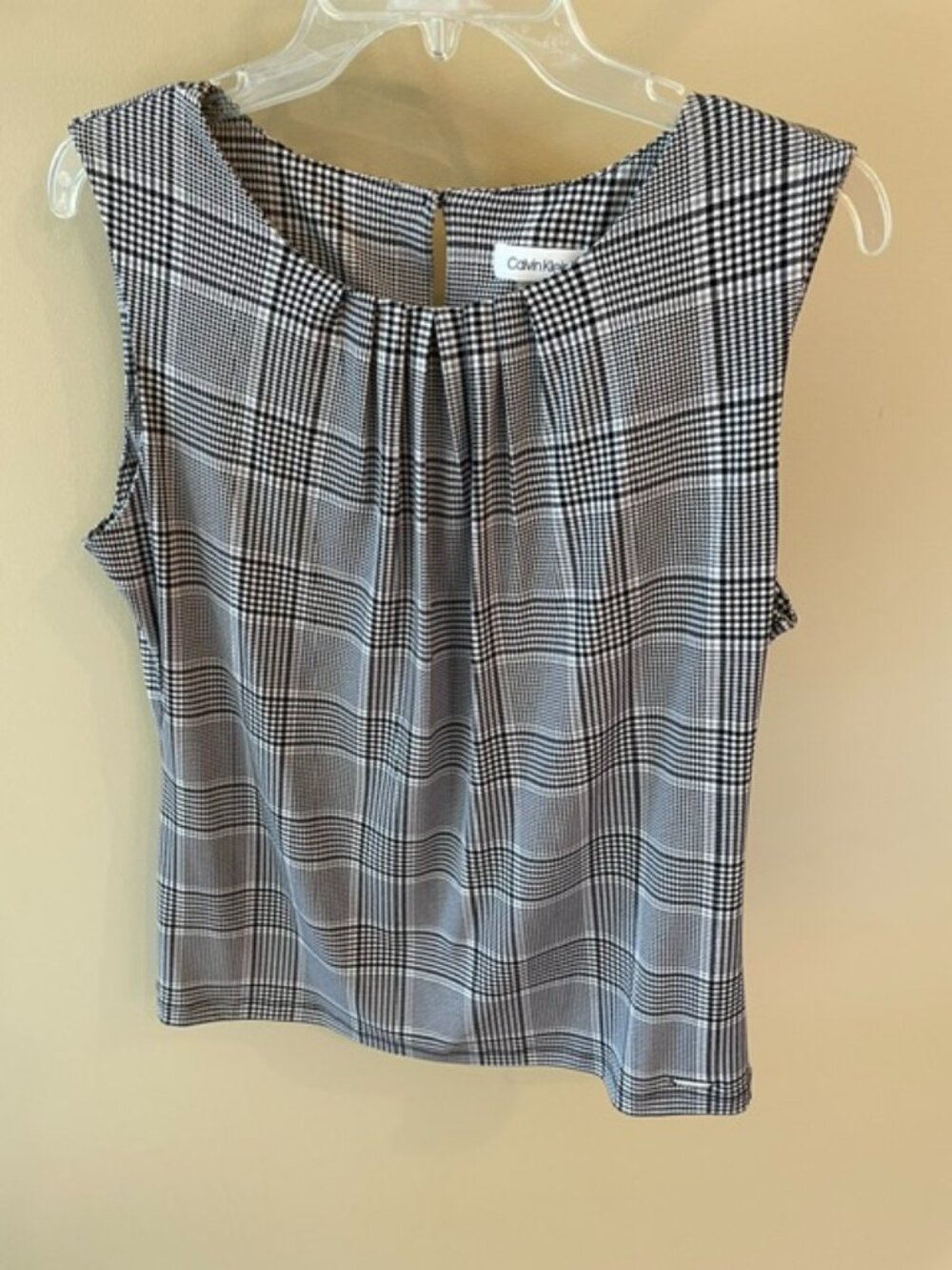 Women's Calvin Klein Sleeveless Blouse in black, grey and white check pattern.